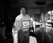 Barry Coffin holds the Celia Smith painting he received for the Phoenix Award for the Visual Arts. Coffin had been nominated by Don and Maria Martin. The 10th annual Phoenix Awards were Nov. 6 at the Lawrence Arts Center.