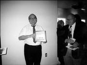 Brad Levy holds his Phoenix Award for Volunteer in the Arts. He had been nominated by Laurie Ward. The Phoenix Awards are chosen from nominations received by the Lawrence Arts Commission, whose members are appointed by the mayor for three-year terms.