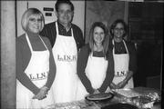 From left, Stephanie Rasys, Dan Gaumer, Ranelle Fischer and Lois Uihlein, of the Lawrence Kiwanis Club, help serve desserts Nov. 22 at the Lawrence Interdenominational Nutrition Kitchen at First Christian Church. Gaumer is president of the local service organization, and Fischer is president-elect.