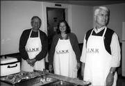 From left, Sam Seminoff, Cathy Howard and Larry Alstrom, of the Lawrence Kiwanis Club, serve entrees Nov. 22 at the Lawrence Interdenominational Nutrition Kitchen at First Chris-tian Church. The club provided the food and served the meal.