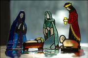 Sallie Dickinson has a Nativity set of stained glass made by her father in the late 1970s and early 1980s. These are five of the 12 pieces.