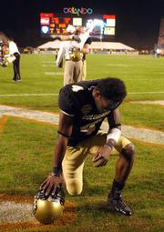 Colorado's Patrick Williams kneels in the end zone after a 19-10 loss to Clemson in the Champs Sports Bowl. The loss Tuesday in Orlando, Fla., was CU's fourth straight setback.