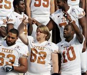 Texas quarterback Vince Young (10) and center Lyle Sendlein gesture during a team photo session at the Rose Bowl. The Longhorns, shown Tuesday in Pasadena, Calif., will play USC in the national-championship game tonight.