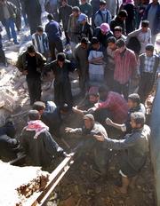 Iraqis search for the bodies of victims of an alleged U.S. airstrike Tuesday in Beiji, Iraq. Iraqi police said U.S. aircraft bombed the house Monday night.