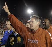 Texas coach mack Brown celebrates after the Longhorns defeated Southern California in the Rose Bowl. Texas won the game, 41-38, and the national championship Wednesday night in Pasadena, Calif.