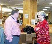 Terry Wells, left, visits with Janet Mody during the annual luncheon for retired faculty and staff of Lawrence High School. The luncheon was Dec. 7 in the LHS library.