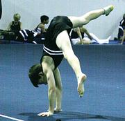 Noel Fisher goes into a handstand position during his floor exercise routine Saturday at the Winter Cup meet. Fisher took first place in the floor exercise event.