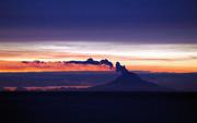 The Augustine Volcano produces a plume of steam last week, seen 70 miles across the Cook Inlet from Homer, Alaska. The volcano erupted on Wednesday, sending an ash plume five miles into the air and disrupting flights.