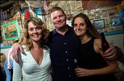 From left are Julie Ransopher, Kansas City, Mo.; Charlie Crumpton, Tulsa, Okla.; and Sherri Willdeman, Lawrence. They celebrated on New Year's Eve at The Sandbar, 17 E. Eighth St.