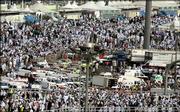 Saudi ambulances gather Thursday at the site where pilgrims stampeded in Mina, Saudi Arabia. A rush to complete one of the last events of the hajj resulted in a stampede in which at least 345 people were killed, the Interior Ministry said. More than 1,000 people were injured, according to the Saudi Red Crescent.