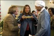 Gerard Depardieu, left, Queen Latifah and LL Cool J star in the romantic comedy "Last Holiday," a remake of the 1950 film of the same name.