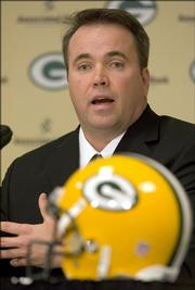 Mike McCarthy answers questions during a news conference after being introducing as the new head coach of the Green Bay Packers on Thursday, Jan. 12, 2006, in Green Bay, Wis. (AP Photo/Mike Roemer)