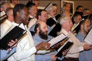 East Hill Singers perform during a recent concert in Topeka. The choir group is a mixture of Lansing Prison inmates and civilian vocalists.