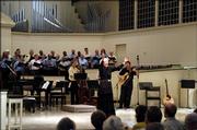 Elvera Voth leads the East Hill Singers during a recent concert at Village Presbyterian Church in Prairie Village.