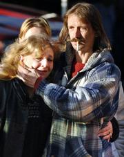 Mourners exit the Bright Star Freewill Baptist Church in Melville, W.Va., Saturday near the Alma No. 1 mine where the bodies of two miners were found Saturday.