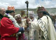 Bolivian President-elect Evo Morales, left, receives an indigenous symbol of leadership from Aymara priest Valentin Mejillones on Saturday at the archaeological site of Tiawanacu, Bolivia, where Morales attended a ceremony to ask Andean gods for help and guidance on the eve of his inauguration as Bolivia's new president.