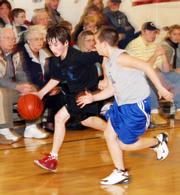 Horned Frog Keith Loneker, right, chases down the sideline after Blue Devil Adam Rea during the Jan. 24 game at Langston Hughes Elementary.