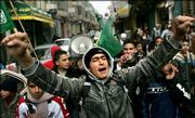 Palestinian high school students chant anti-Danish slogans during a demonstration Saturday in the West Bank town of Ramallah. Hundreds of Palestinians marched through the streets of Gaza City, some storming European buildings and burning German and Danish flags, to protest cartoons deemed insulting to the Prophet Muhammad.