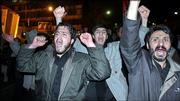 Iranians chant slogans Saturday during a demonstration to support Iran's nuclear program and to protest against the publication of cartoons mocking the Prophet Muhammad in European newspapers in Tehran, Iran.