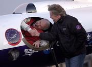 Pilot Steve Fossett shakes hands with Sir Richard Branson as he prepares to take off in the GlobalFlyer on Feb. 28, 2005, at the Salina Municipal Airport in Salina. Fossett plans to use the GlobalFlyer in an attempt to break the record for longest flight.