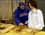 Ken Simmons and April Young, both Kansas University architecture students, look over some angles for a community center their architecture class is building to help residents of the Seventh Ward in New Orleans.