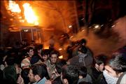 Protesters flee after police spray tear gas in front of the Danish Embassy in Tehran, Iran. Police had encircled the embassy building on Monday but were unable to hold back the mob of 400 demonstrators as they pelted the walled brick villa housing the Danish mission with stones and Molotov cocktails. The protests were among several in Islamic nations Monday sparked by the publication of cartoons deemed insulting to the religion.