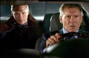 Bill Cox (Paul Bettany), left, takes Jack Stanfield (Harrison Ford) and his family hostage in an effort to compel the security executive to rob his own bank in the thriller "Firewall."