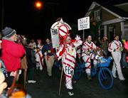 The satirical Krewe du Vieux parade makes its way Saturday through the French Quarter as it laughs at authorities and the tragedy of Hurricane Katrina in New Orleans.