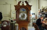 Time stands still around store owner Gary Strong as he repairs a clock at Strong's Antiques, 1025 Mass.
