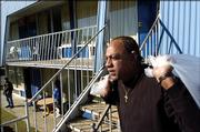 David P. Jackson, from New Orleans, carries some of his possessions to his room at the Pelican Haven Shelter in Shreveport, La., Monday, Feb. 13, 2006. Monday marks the second wave of evacuees losing Federal Emergency Management Agency financing of their hotel rooms. Jackson, had been staying in a hotel in Mansfield, La., but had to leave because of the extension deadline. FEMA promised the evacuees from Hurricanes Katrina and Rita that they will still receive federal rent assistance that they can put toward hotel stays or other housing. But the agency will no longer pay for their hotel rooms directly.