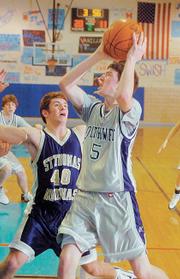 Southwest forward Lance Kilburn shoots for two of his game-high 17 points against Aquinas in the championship game of the Warhawk Invitational held at West Junior High.