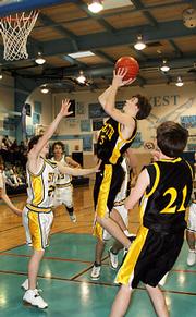 Cougar Jake Green takes a shot late in the fourth quarter of the fifth-place game of the Warhawk Invitational.
