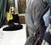 An injured Iraqi girl sits on a bed in Yarmouk hospital in Baghdad following an explosion at an outdoor market in a Shiite area of southwestern Baghdad, killing 22 people and injuring 28, police said. Tuesday's attack appeared to be the deadliest car bombing against civilians in the capital in weeks.