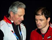 Markus Gandler, head of Austria's biathlon and cross-country team, right, confers with Jo Schmid, spokesman of Austria's Skiing Federation during a press conference in Sestriere, northern Italy, Friday, Feb. 24, 2006. Gandler made a statement concerning last week's anti-doping raid on the Austrian biathlon and cross-country teams, the first raid on Olympic athletes involving police.