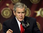 President Bush pauses during a lengthy address on the global war on terrorism at a gathering of the American Legion in Washington, Friday, Feb. 24, 2006. Bush says the situation in Iraq remains "serious." But the president also says he's "optimistic" Iraqis will turn away from civil warfare in what he calls their "moment of choosing" after scores of people have died since the bombing of a landmark Shiite mosque.