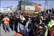 Longshoremen and Teamsters union members protest against the sale of some American port operations to a state-owned Dubai company at a rally at one of the ports, Port Newark, in Newark, N.J., Monday, Feb. 27, 2006.