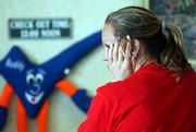 Hurricane Rita victim Donna Francis, 39, of Silsbee, Texas, stands at the front desk of the Best Value Inn on Wednesday in Beaumont, Texas, as she waits to hear if she got an extension from the FEMA hotel program. The deadline for hurricane victims to lose their FEMA-paid rooms was Wednesday unless they received an extension.