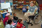 Amanda Trei, special education teacher at Hillcrest Elementary school, reads to students Thursday in a newcomer class. Trei is participating in a Ms. Wheelchair Kansas pageant Sunday in Topeka.