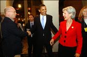 Senator Barack Obama, D-Illinois, center, shakes hands with Topekan Ted Ensley as Obama is escorted by Gov. Kathleen Sebelius to the ballroom of the downtown Topeka Ramada Inn, in this file photo. Late Friday, Obama selected Delaware Sen. Joe Biden for the Democratic ticket, ending a frenzy of speculation that also swirled around Sebelius, who was considered by most political observers as among the top tier of possible nominees.
