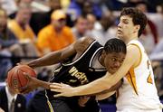 Wichita State's P.J. Couisnard, left, plays keep-away from Tennessee's Dane Bradshaw in the Shockers' 80-73 victory.
WSU advanced to the Sweet 16 with the win Saturday in Greensboro, N.C.