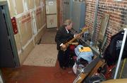 Dennis Fox Higgins of the group Spider & the Crabs tunes his bass backstage before the start of the Kansas Music Hall of Fame ceremony. The Saturday night event honoring musical acts and artists from across the state was held at Liberty Hall, 642 Mass.