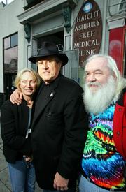 Dr. David Smith, center, stands outside the Haight Ashbury Free Medical Clinic with his wife, Millicent Buxton-Smith, and former IT manager Bob Student in San Francisco. "Dr. Dave" opened the clinic in 1967 but quit last month when a new CEO made changes to increase the clinic&squot;s financial accountability.
