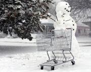 A big snowman, a little snowman and a shopping cart create a work of art on a residential street Monday in Lincoln, Neb. Parts of Nebraska got up to 25 inches of snow through Monday, and the Nebraska Legislature canceled its session for today.