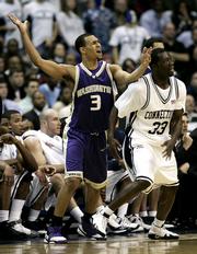 Washington's Brandon Roy (3) reacts in disgust as Connecticut's Denham Brown defends during their Sweet 16 game. UConn won, 98-92 in overtime, Friday in Washington.