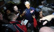 Lamar Butler, top, of the George Mason Patriots basketball team talks to the media at the Patriot Center, Monday, March 27, 2005 in Fairfax, Va. George Mason advanced to play in the NCAA Final Four with their win against Connecticut yesterday.