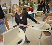 Stephanie Mueller works at a "standing" desk in an experimental classroom at Elton Hills Elementary School in Rochester, Minn. Obesity researchers from the Mayo Clinic want to learn whether classrooms really need desks, or if being able to move around helps students fight obesity while they learn.
