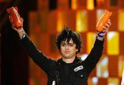 Green Day lead singer Billie Joe Armstrong accepts awards for favorite music group and favorite song, "Wake Me Up When September Ends," at the Kids&squot; Choice Awards on Saturday in Los Angeles. Winners were chosen by fans who voted online.