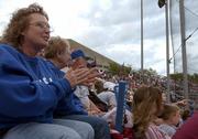 Cheryl Wonnell claps and gives encouragement while Jayhawk batter Andy Scholl steps up to the plate in this 2005 file photo.