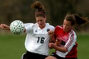 Free State sophomore Taylor Case (16) battles Lawrence High junior Erika Hierl for the ball. The Lions beat the Firebirds, 3-0, Tuesday at Free State's field.