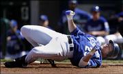 Kansas City's Mike Sweeney hits the deck after getting buzzed by White Sox pitcher Bobby Jenks during the ninth inning. Chicago won, 3-1, Sunday in Kansas City, Mo.